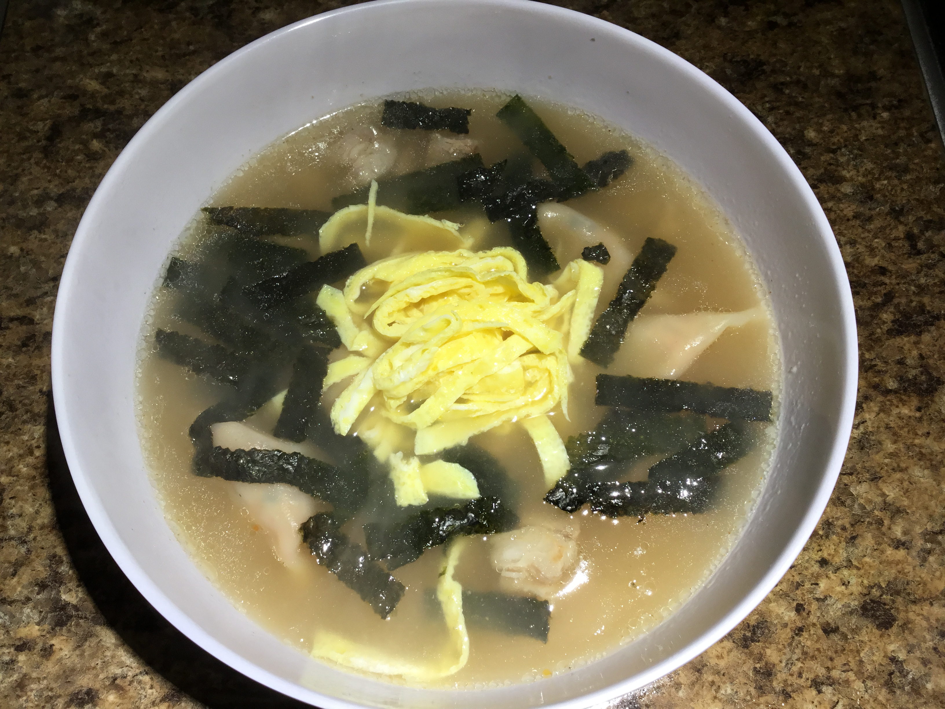 Rice Cake Soup with Kimchi Dumplings and Pork Riblets