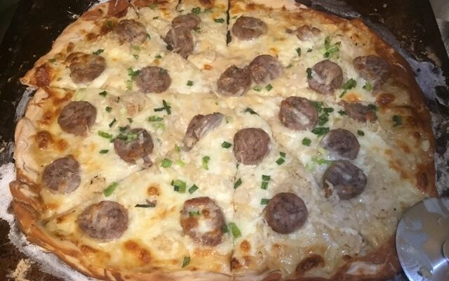Brat and Kraut Pizza with Tillamook Cheddar Sauce