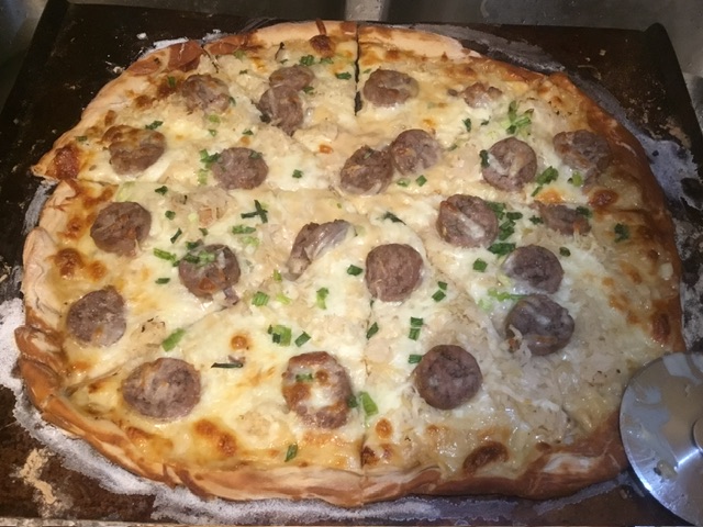Brat and Kraut Pizza with Tillamook Cheddar Sauce